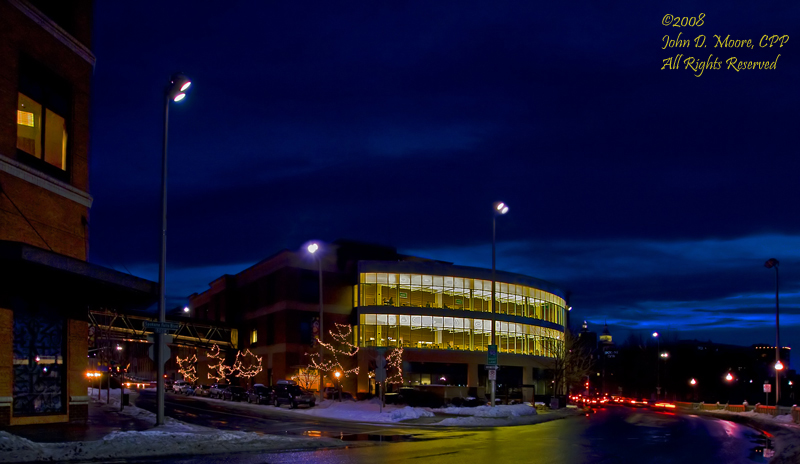 It is  cold and icy directly behind the downtown branch of the City Library.