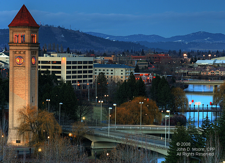 In Spokane's Riverfront Park, daylight transitions into darkness.