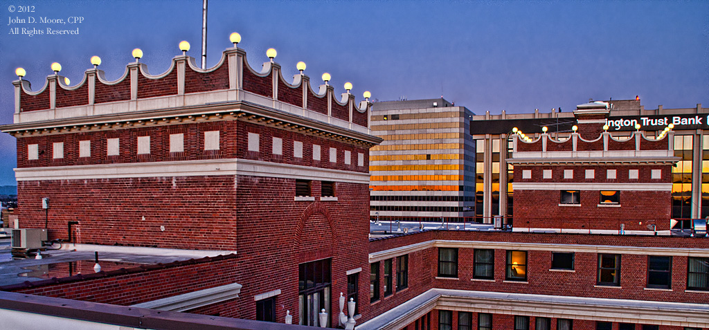 As the lights turn on, on top of Spokane's Davenport Hotel 