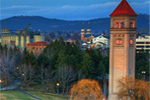 In Spokane's Riverfront Park, daylight transitions into darkness. 