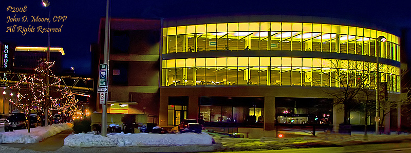 It is  cold and icy directly behind the downtown branch of the City Library.