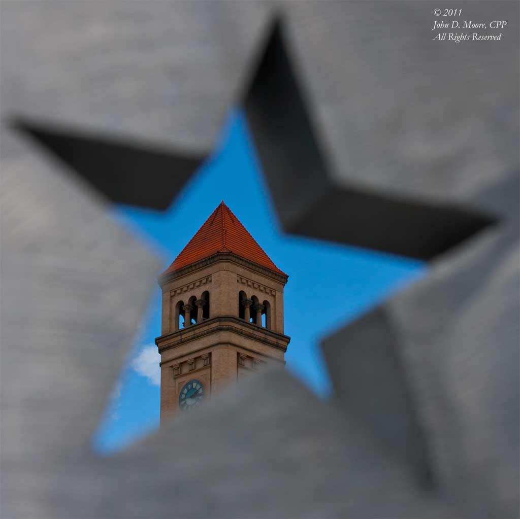 The Clocktower as viewed through a sculpture of the United States Flag.  Riverfront Park, Spokane, Washington.