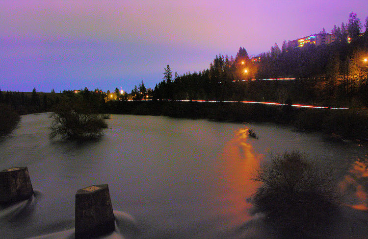 Peaceful Valley footbridge, looking east (toward downtown) over a swollen Spokane River, Spokane, Washington