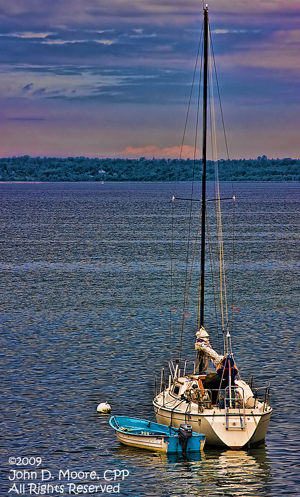 Preparing the boat to head north.  As sunset arrives on the Bellingham Bay, Bellingham, Washington.  