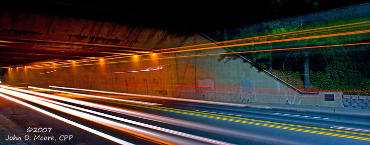 STA bus, trucks and cars travel on the north end of the Washington Street Underpass.