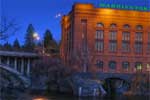 The Spokane River, passes by the Washington Water Power building.
